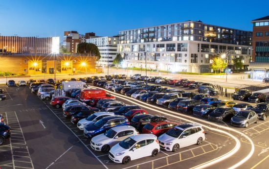 Aerial view of Princes Street Car illuminated at dusk with long exposure