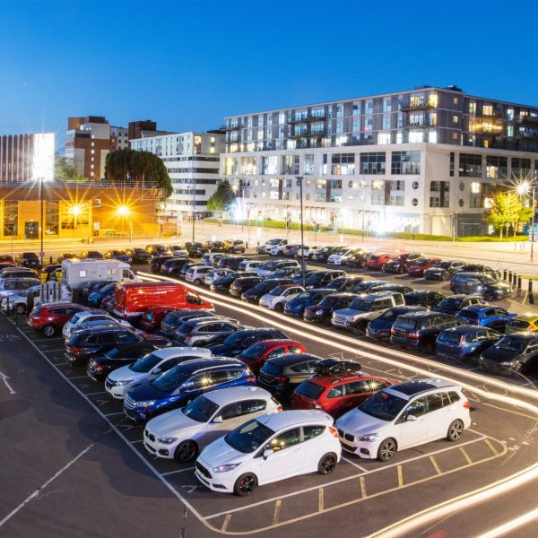 Aerial view of Princes Street Car illuminated at dusk with long exposure